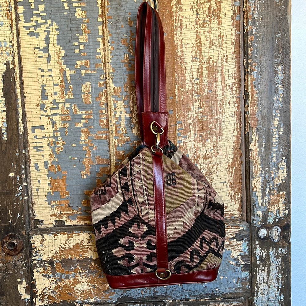 Kilim convertible shoulder to backpack.